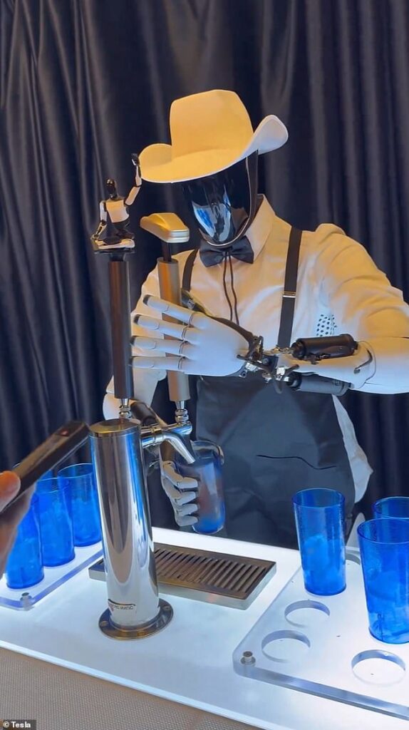 Tesla’s new robot Optimus dons ridiculous outfit at event hosted by Elon Musk