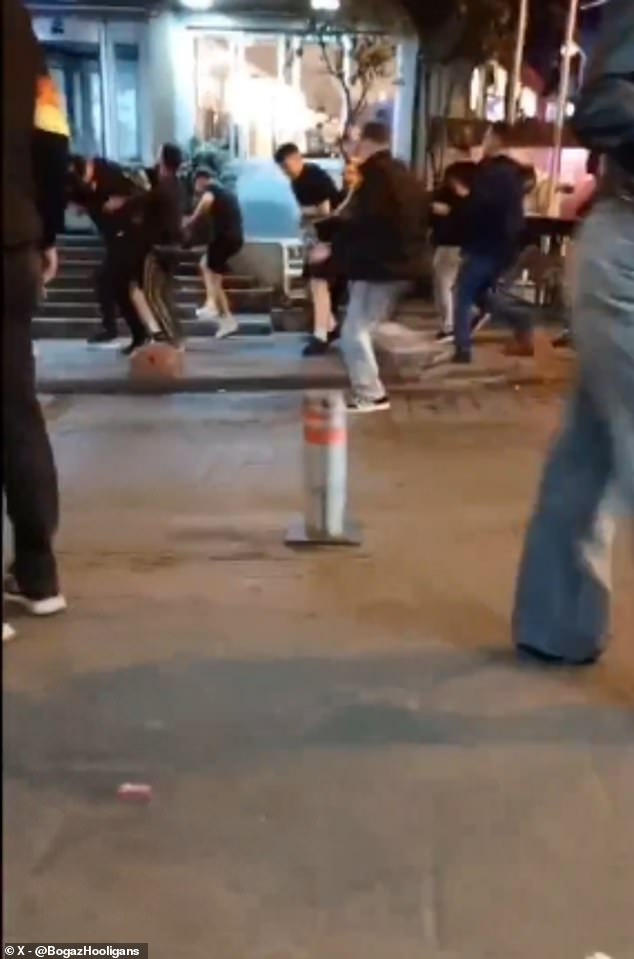 Man United fans attacked by Fenerbahce ultras in streets of Istanbul – as supporter claims ’50 of them swarmed us leaving multiple injured’