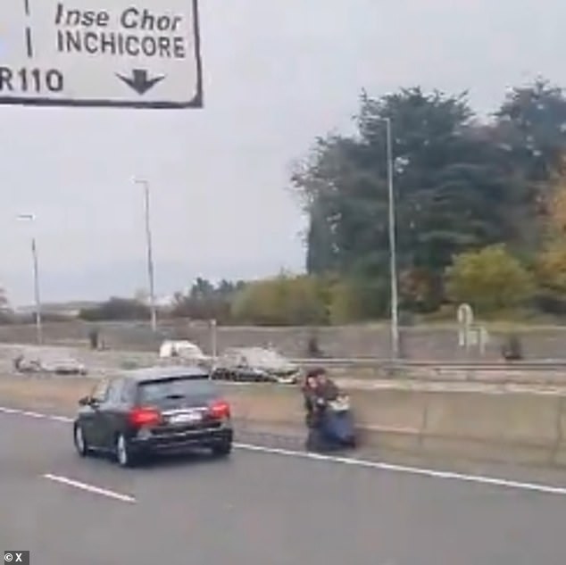 Strife in the fast lane: Shocking moment pensioner in a mobility scooter is seen trundling the wrong way down a motorway