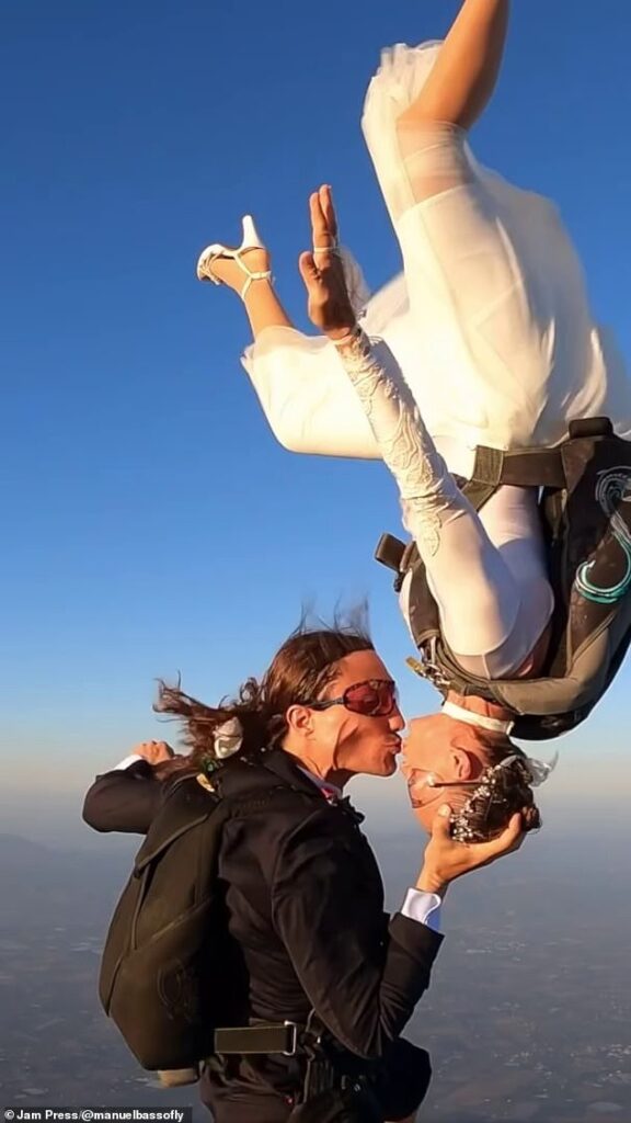 Stunning moment woman dubbed the ‘world’s sexiest skydiver’ ties the knot with her husband, 38, during daring parachute jump