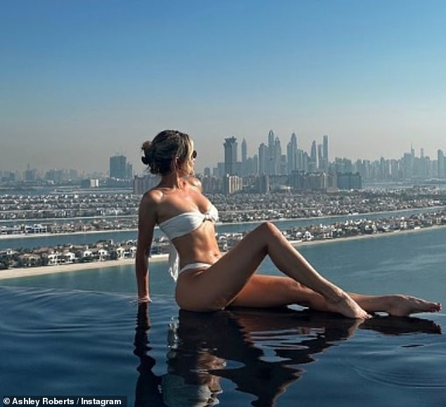 Ashley Roberts flaunts her incredible figure in a skimpy white bikini as she shares sizzling snaps from her lavish Dubai getaway