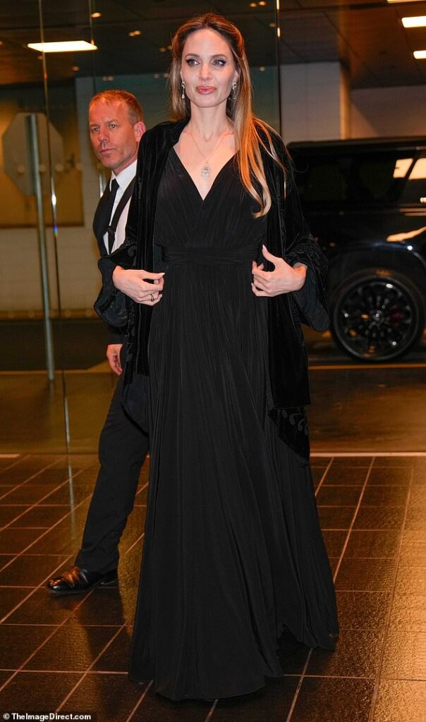Angelia Jolie is the epitome of class in a plunging gown while promoting biopic Maria in NYC