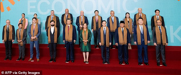 Humiliation for Biden as he’s shoved to back of ‘family photo’ with world leaders while China’s Xi gets front-row spot