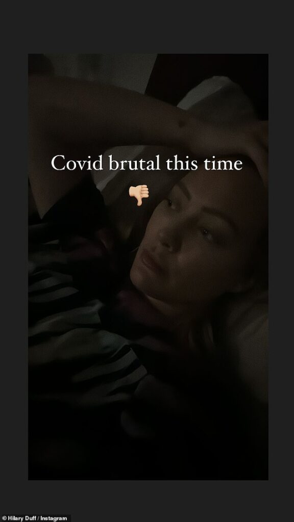 Hilary Duff gives health update and says COVID-19 has been ‘brutal this time’ as she shares selfie from bed… after announcing fourth pregnancy