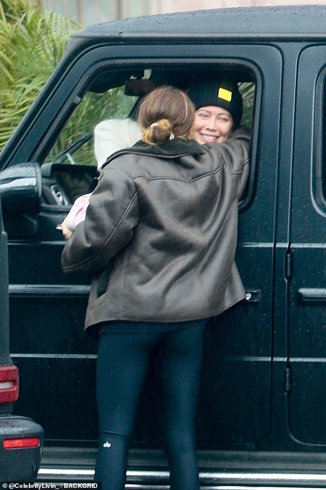 Pregnant Hilary Duff receives a hug from Ashley Tisdale after going out of her way during the LA rainstorm to drop off her ‘famous’ homemade sourdough bread