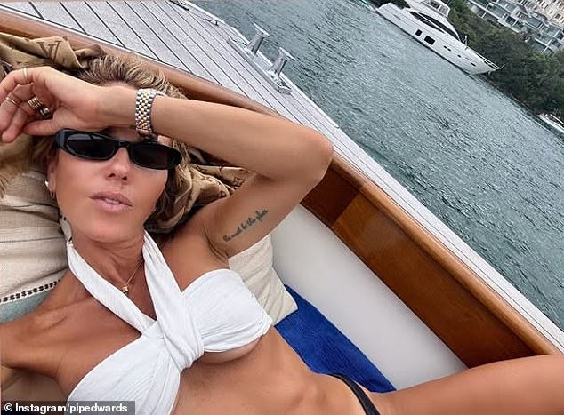 Pip Edwards flaunts her underboob as she lounges on yacht in VERY skimpy bikini after confirming new romance