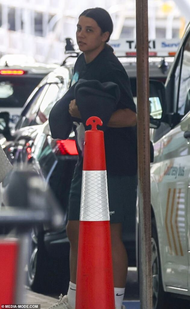 Sam Kerr looks sombre as she flies home to Perth with her parents as her grandmother is in critical condition after being hit by a ute – while man, 63, is charged