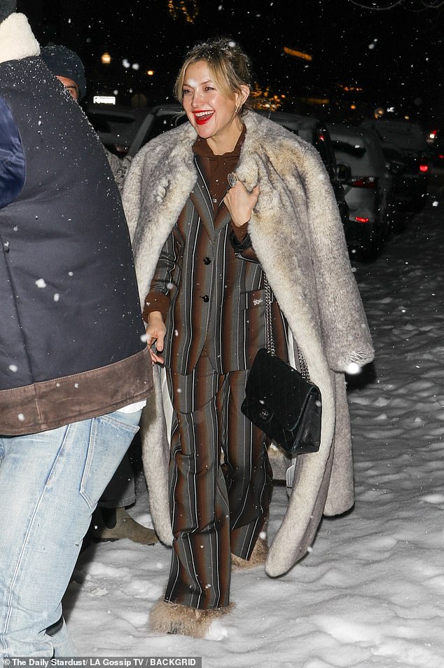 Kate Hudson looks glamorous in a fur coat after enjoying fancy dinner in snowy Aspen