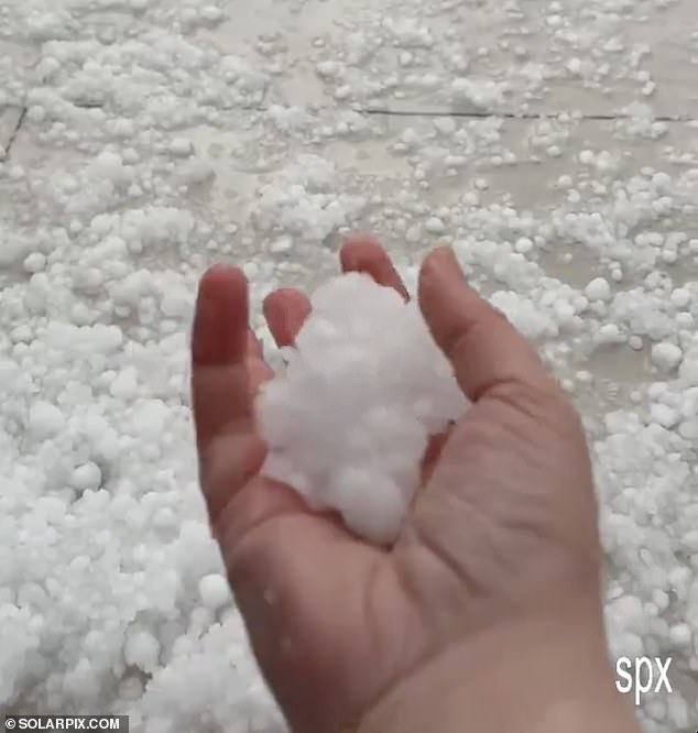 Malaga turns white after freak winter storm with roads turning to rivers as Spain’s wild weather continues