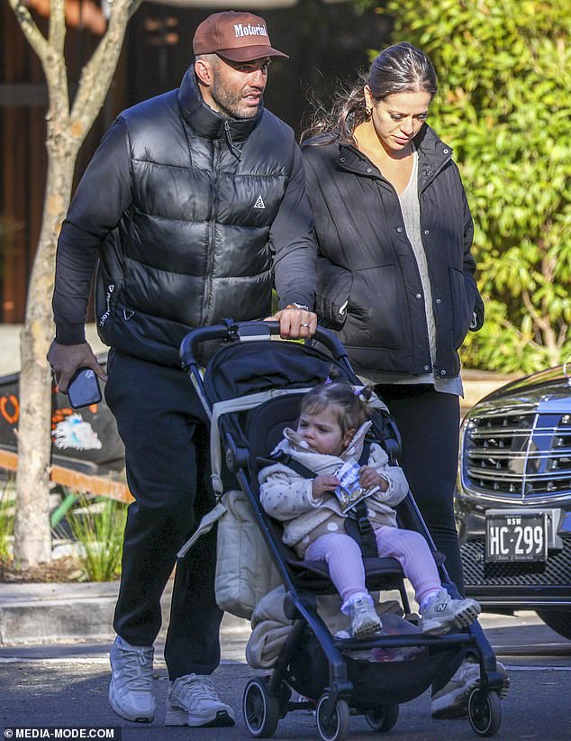Footy star James Tedesco and his pregnant wife step out with their adorable baby daughter as he leads his team’s amazing turnaround