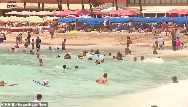 Shocking video shows swimmers and sunbathers IGNORING tsunami warning on Hawaii’s Waikiki Beach