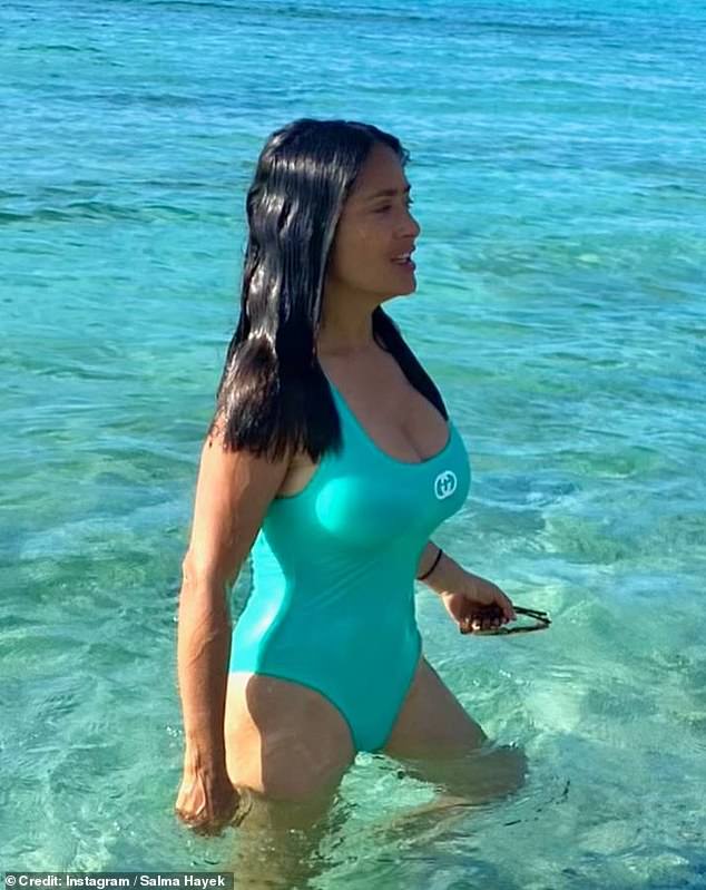 Salma Hayek, 56, shows off her youthful physique in a plunging turquoise bikini during sunshine break in Mexico