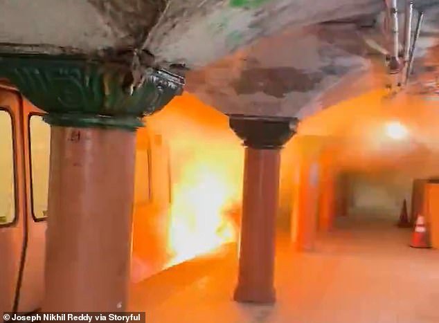 Terrifying moment panicked passengers flee subway after fire breaks out on train