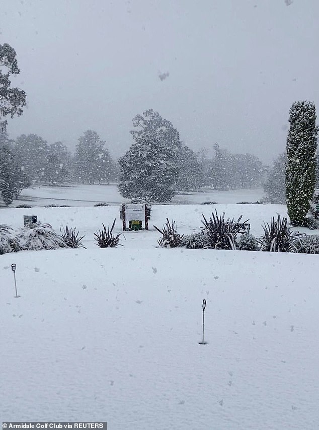 Australia is hit by its biggest snowfall for decades with wild weather bringing 20 inches of snow in some areas