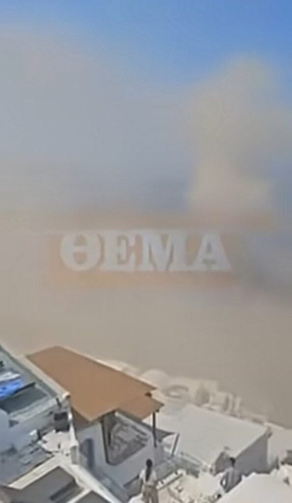 Moment massive landslide crashes into the sea in Santorini engulfing village with dust as tourists watch on – six months after holiday island was rattled by earthquakes