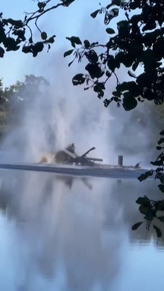 Moment French helicopter tailspins out of control and crashes down while collecting water to fight house fire… with crew somehow surviving