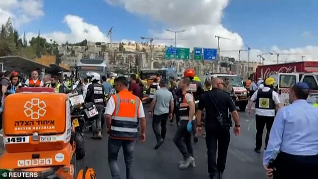 Terrifying moment gunmen kill six people including pregnant woman and leave multiple wounded as they open fire with automatic weapons on board bus in Jerusalem, sending civilians fleeing