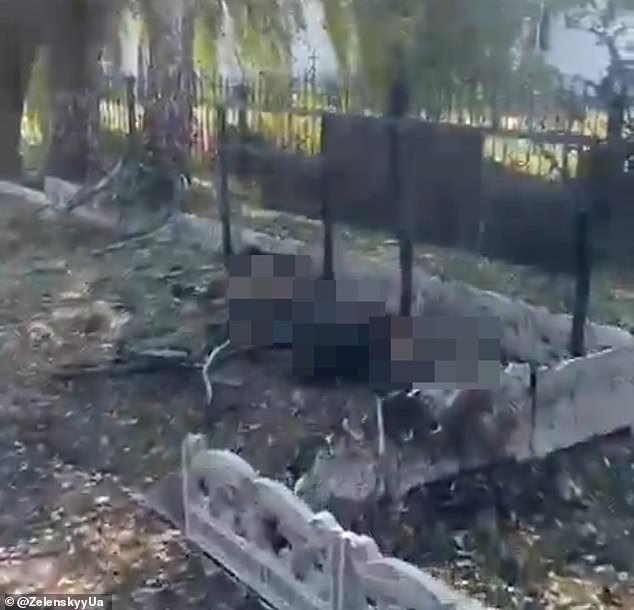Bombed as they collected their pensions: Zelensky shares horrific video showing bodies strewn across the ground after Putin airstrike hit villagers waiting in line
