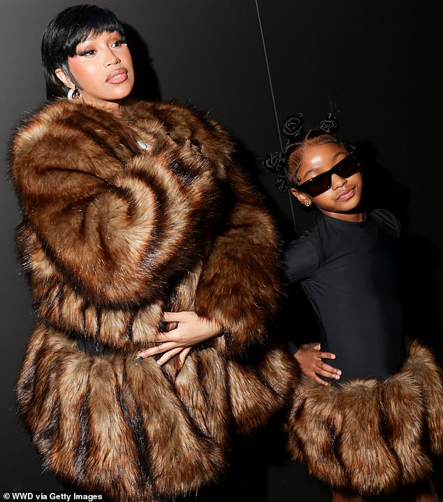 Cardi B twins with lookalike daughter Kulture, seven, at NYFW party after assault trial victory