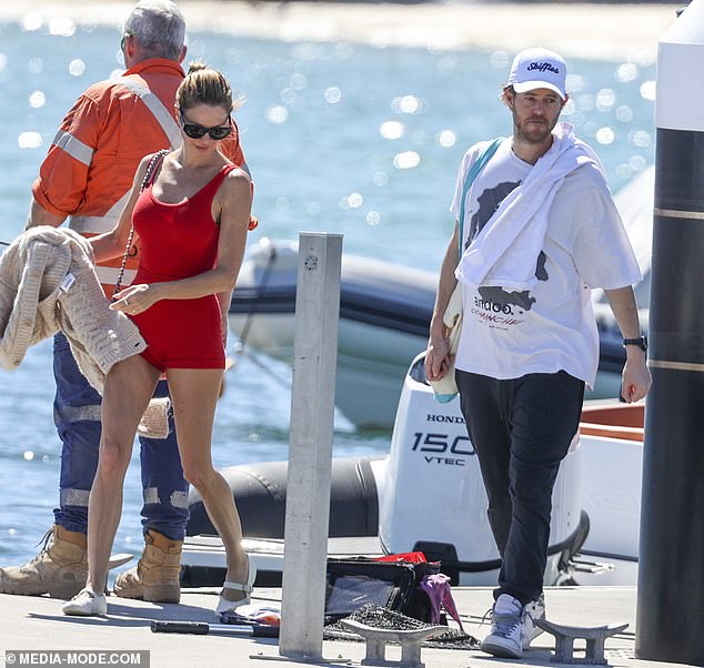 Dina Broadhurst flaunts her figure in a VERY revealing bodysuit as she cruises around Sydney Harbour on a luxury yacht with her multimillionaire boyfriend John Winning